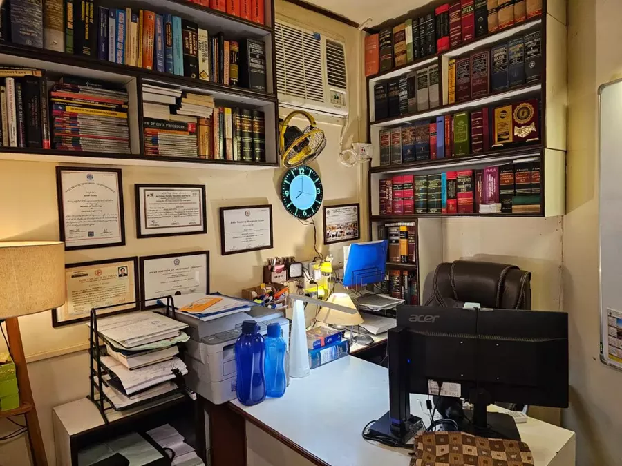 Law library with statutes and case-law reporters at the Kolkata chambers