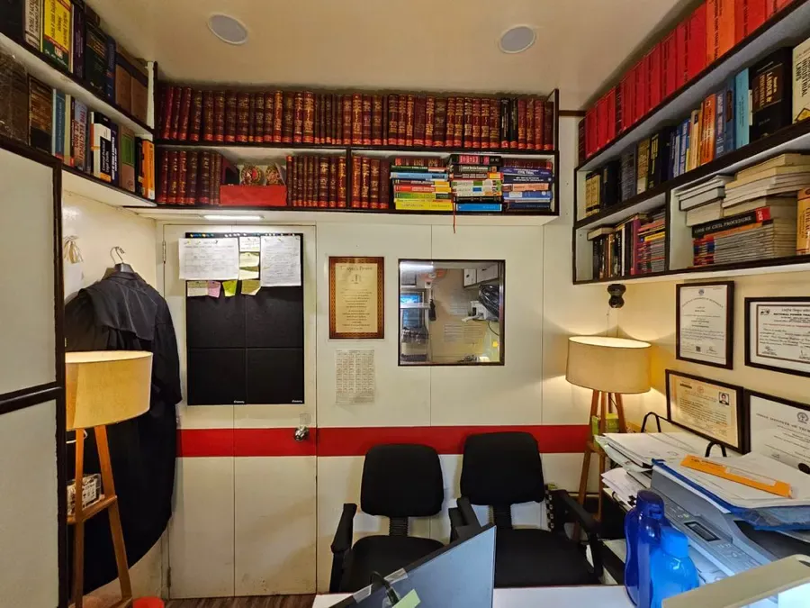 Working chamber with reference library, court robe and client chairs in Kolkata