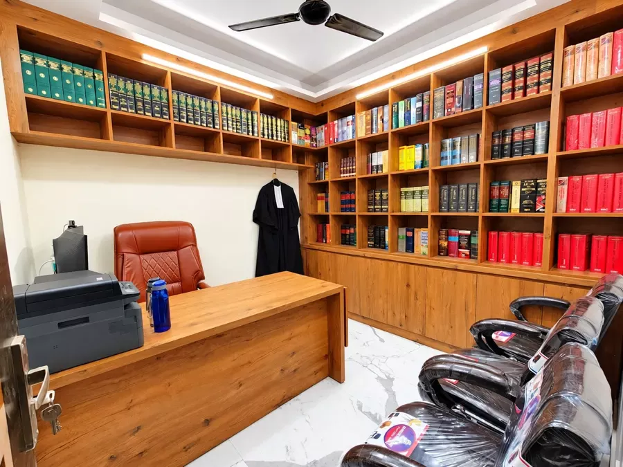 Advocate's chamber in Delhi with client seating and court robe