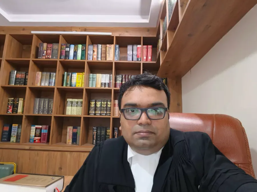 Advocate Sudip Patra working at his desk in the Delhi chambers
