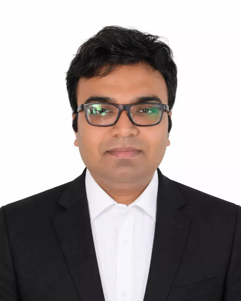 Advocate Sudip Patra, founder of Patra's Law Chambers, in a dark suit and white shirt