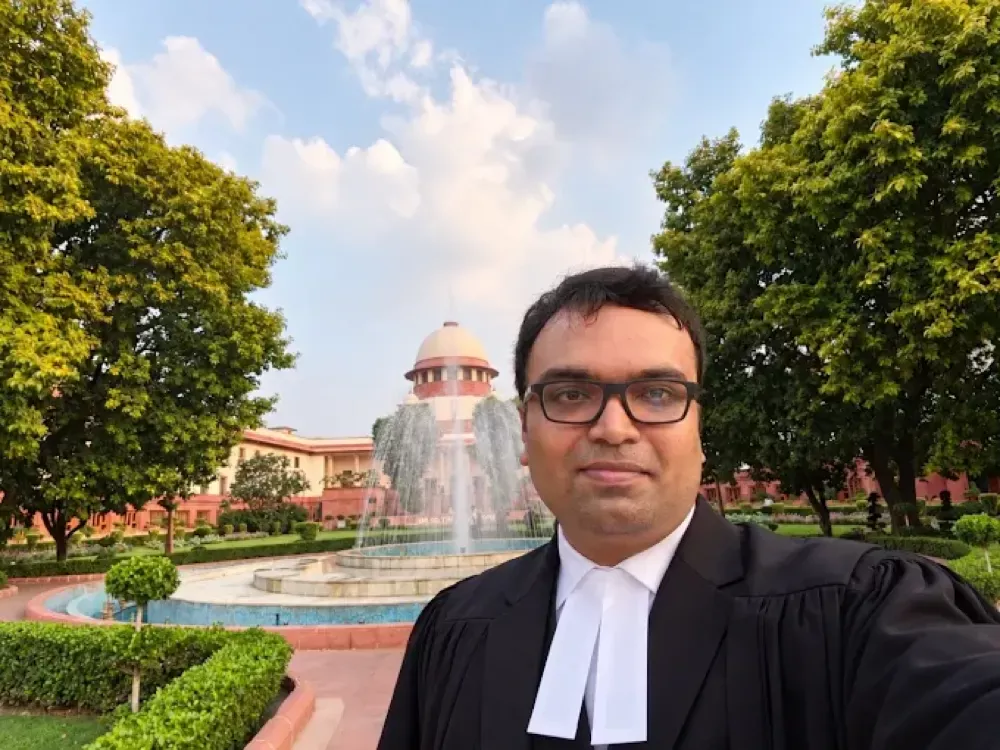 Advocate Sudip Patra in court robes and bands in front of the Supreme Court of India, New Delhi