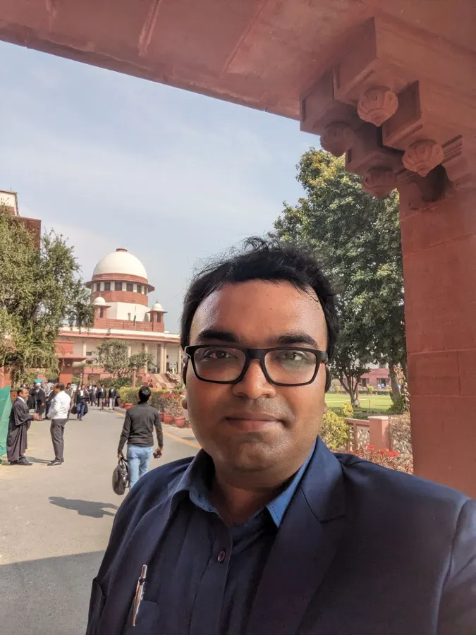 Advocate Sudip Patra with the Supreme Court of India dome in the background